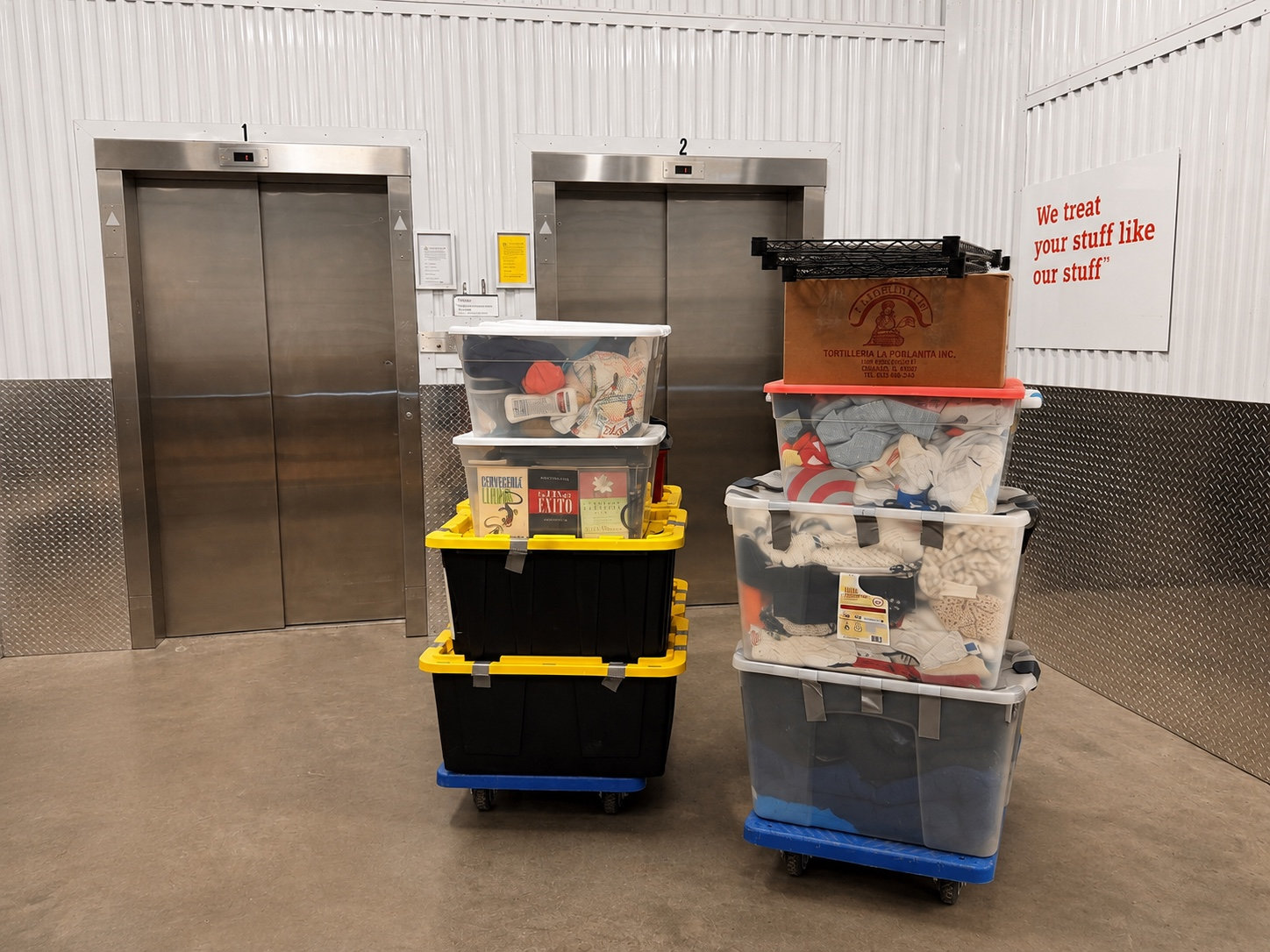 Moving bins on dollies by building elevators