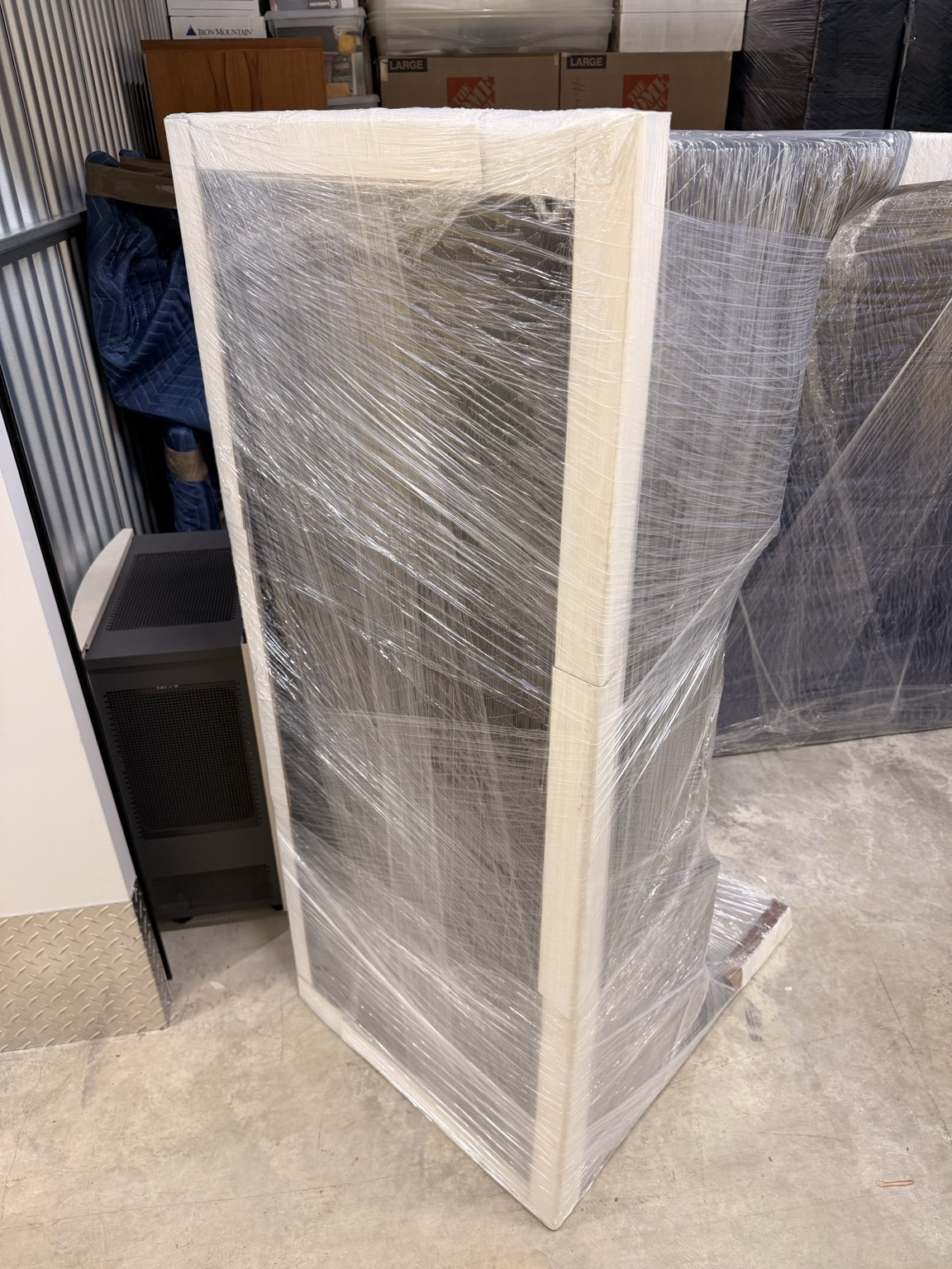 Furniture protected with stretch wrap and corner protection
