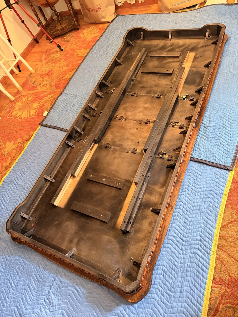 A furniture piece prepared on protective moving blankets
